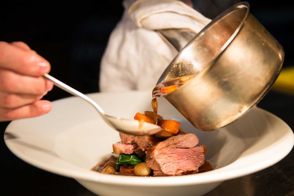 The Millstone, Mellor Hotel Blackburn  Kültér fotó A chef plating a dish